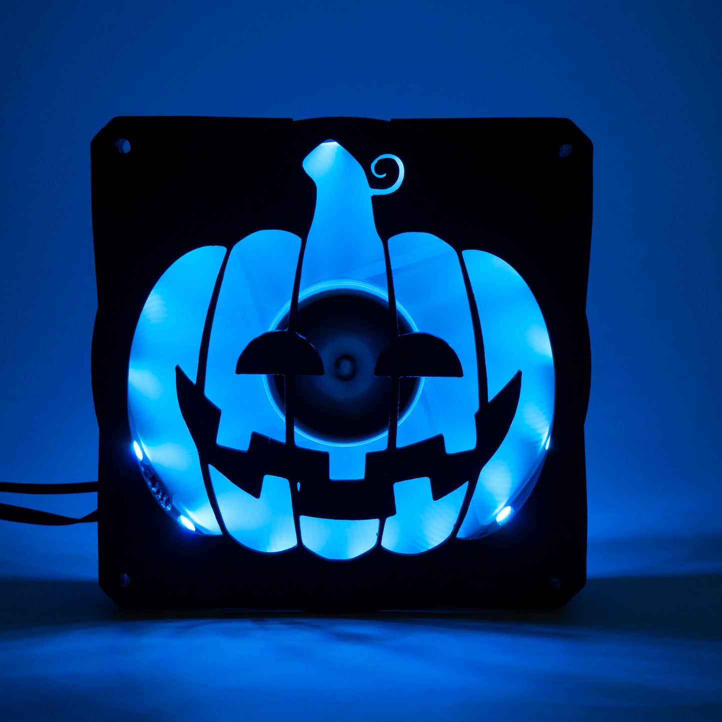 3D printed PC fan grill shaped like a spooky jack-o'-lantern pumpkin. Perfect Halloween-themed case mod for gamers and tech lovers.