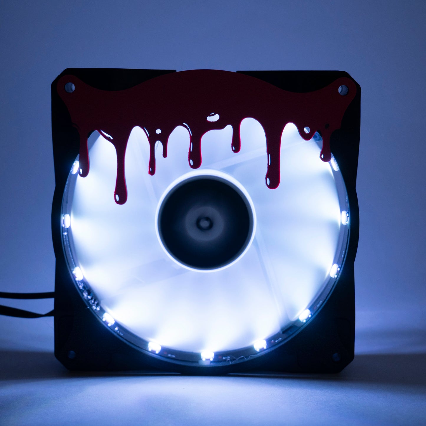 3D printed blood drip fan grill for PC case mods. Adds spooky horror vibes to any gaming setup. Perfect for Halloween or creepy gamer aesthetics.