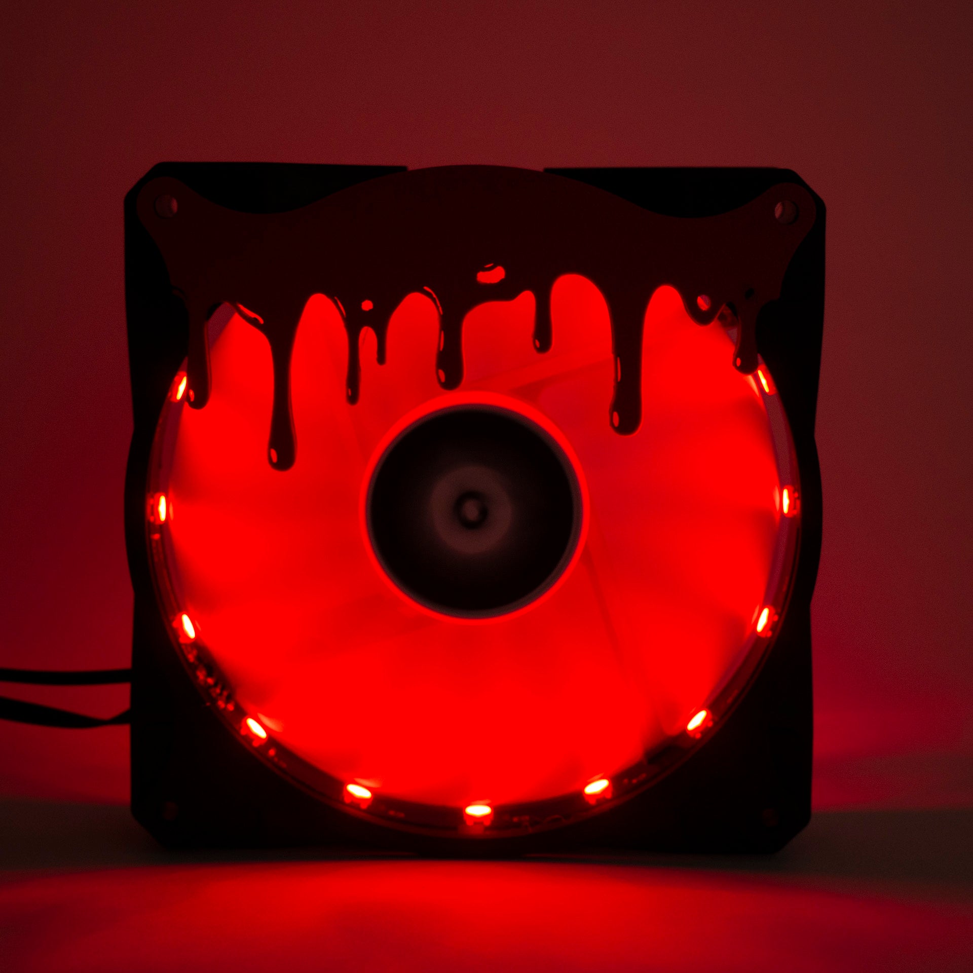 3D printed blood drip fan grill for PC case mods. Adds spooky horror vibes to any gaming setup. Perfect for Halloween or creepy gamer aesthetics.