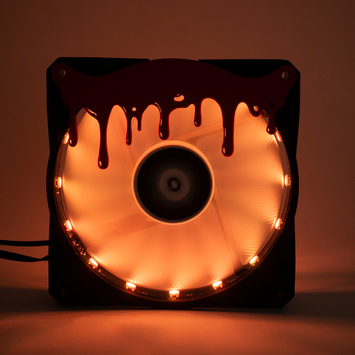 3D printed blood drip fan grill for PC case mods. Adds spooky horror vibes to any gaming setup. Perfect for Halloween or creepy gamer aesthetics.
