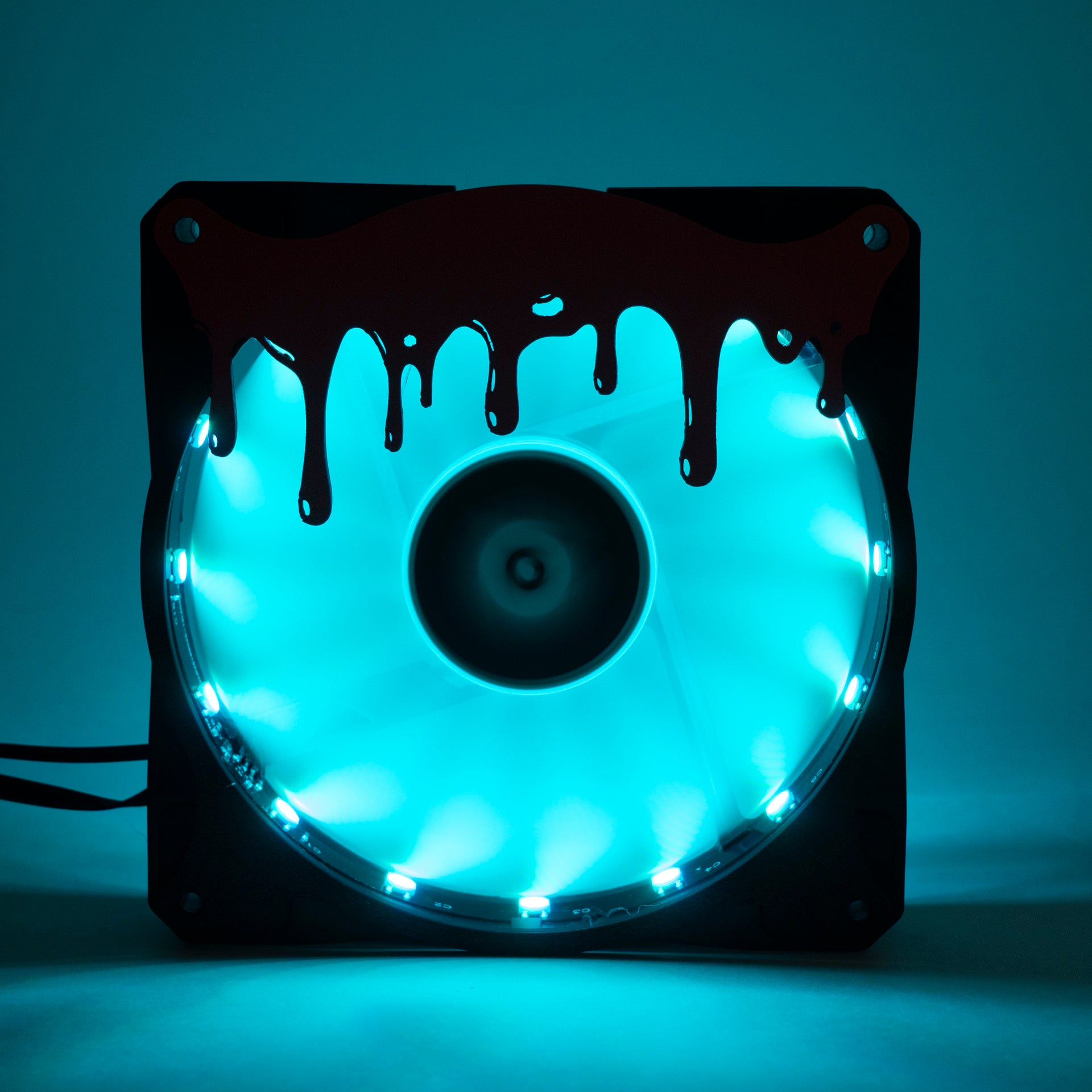 3D printed blood drip fan grill for PC case mods. Adds spooky horror vibes to any gaming setup. Perfect for Halloween or creepy gamer aesthetics.
