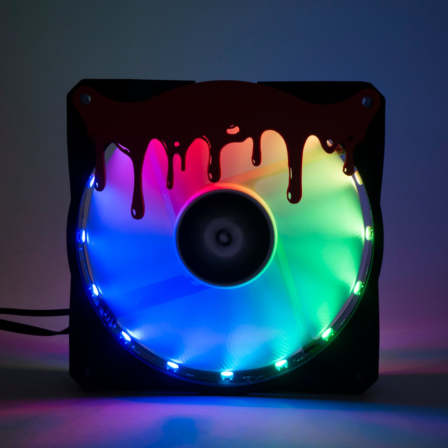 3D printed blood drip fan grill for PC case mods. Adds spooky horror vibes to any gaming setup. Perfect for Halloween or creepy gamer aesthetics.