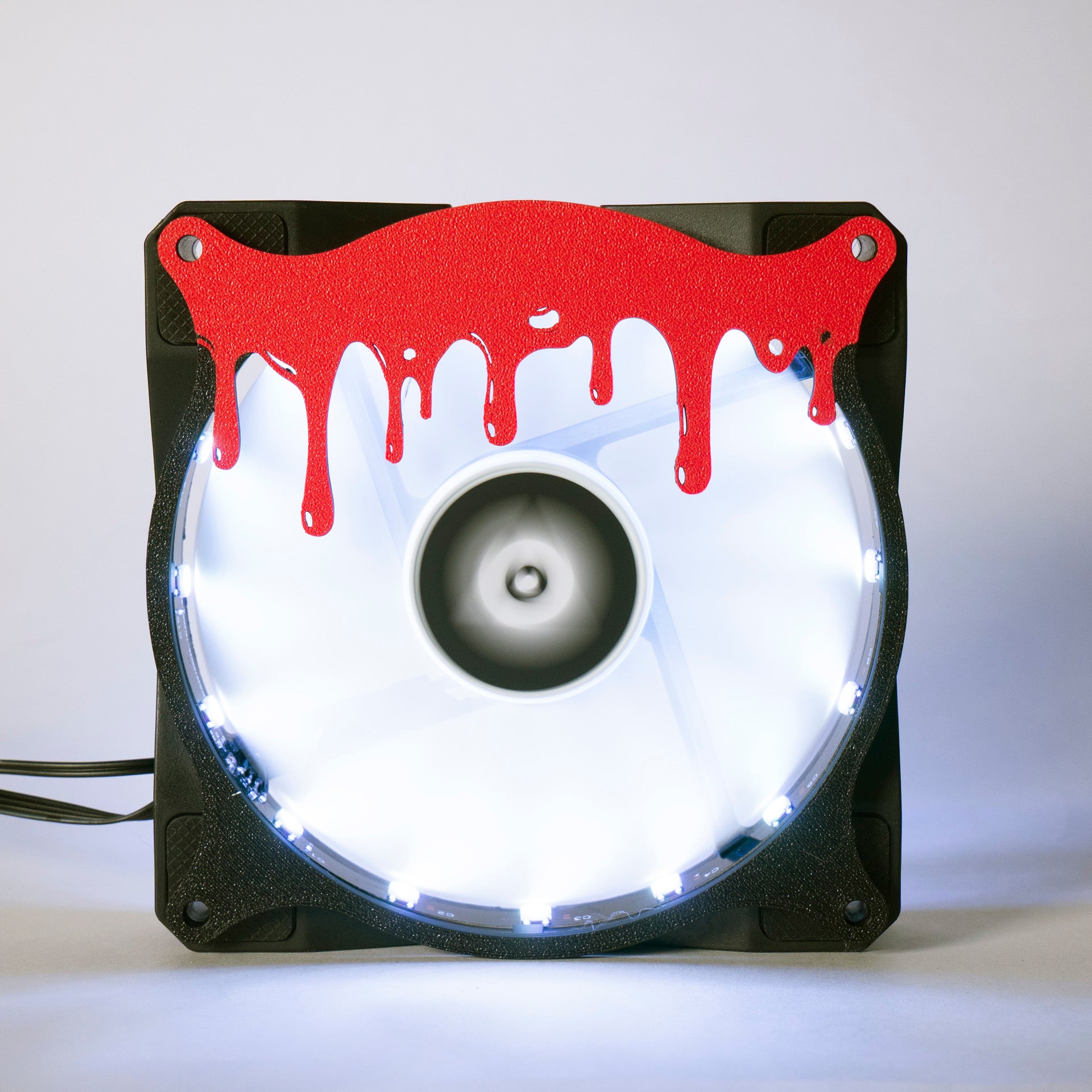 3D printed blood drip fan grill for PC case mods. Adds spooky horror vibes to any gaming setup. Perfect for Halloween or creepy gamer aesthetics.