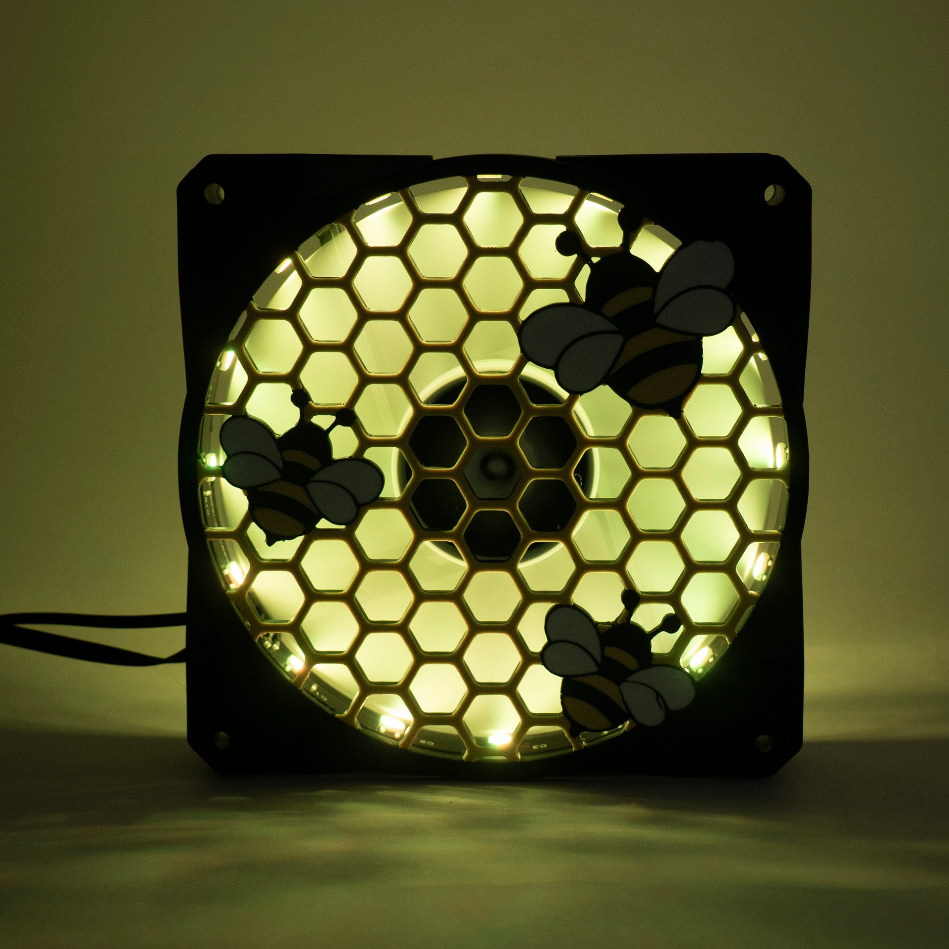 Adorable 3D printed PC fan grill featuring bees and honeycomb. Perfect for customizing aesthetic gamer setups with a cute, nature-inspired design.