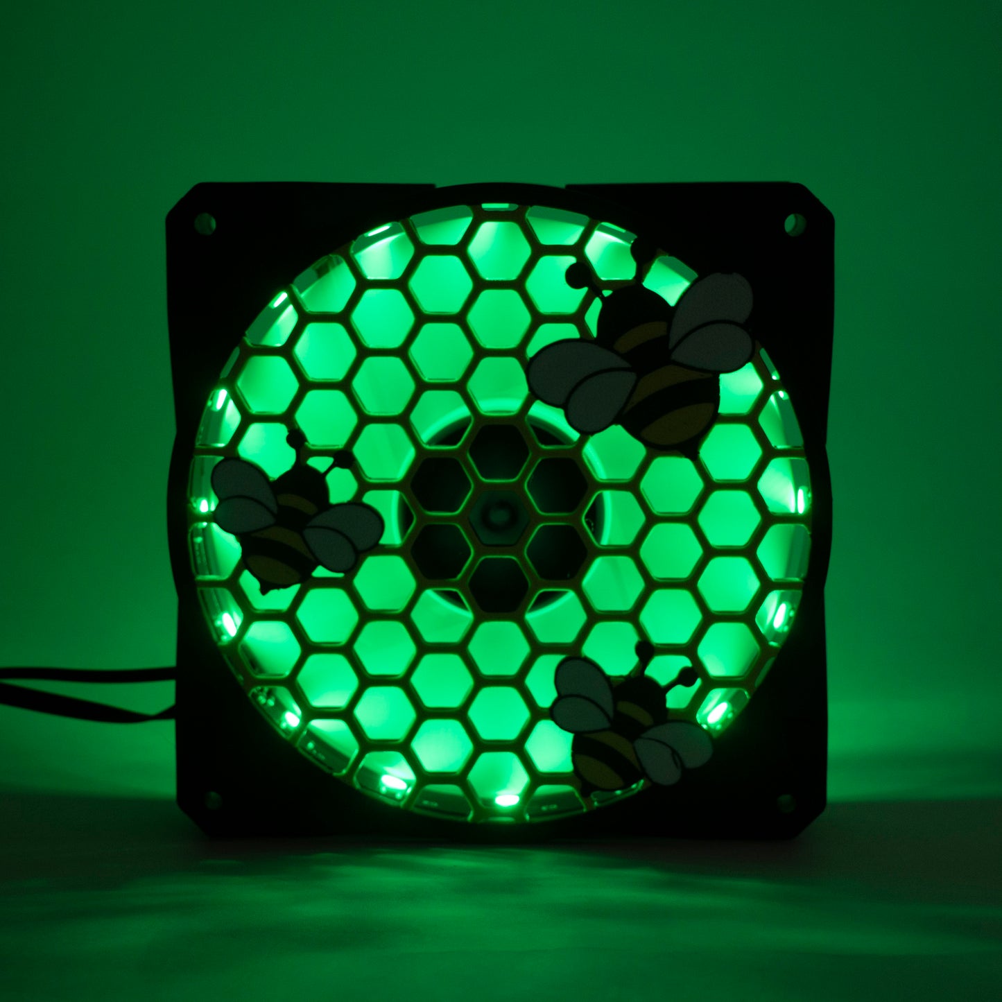 Adorable 3D printed PC fan grill featuring bees and honeycomb. Perfect for customizing aesthetic gamer setups with a cute, nature-inspired design.