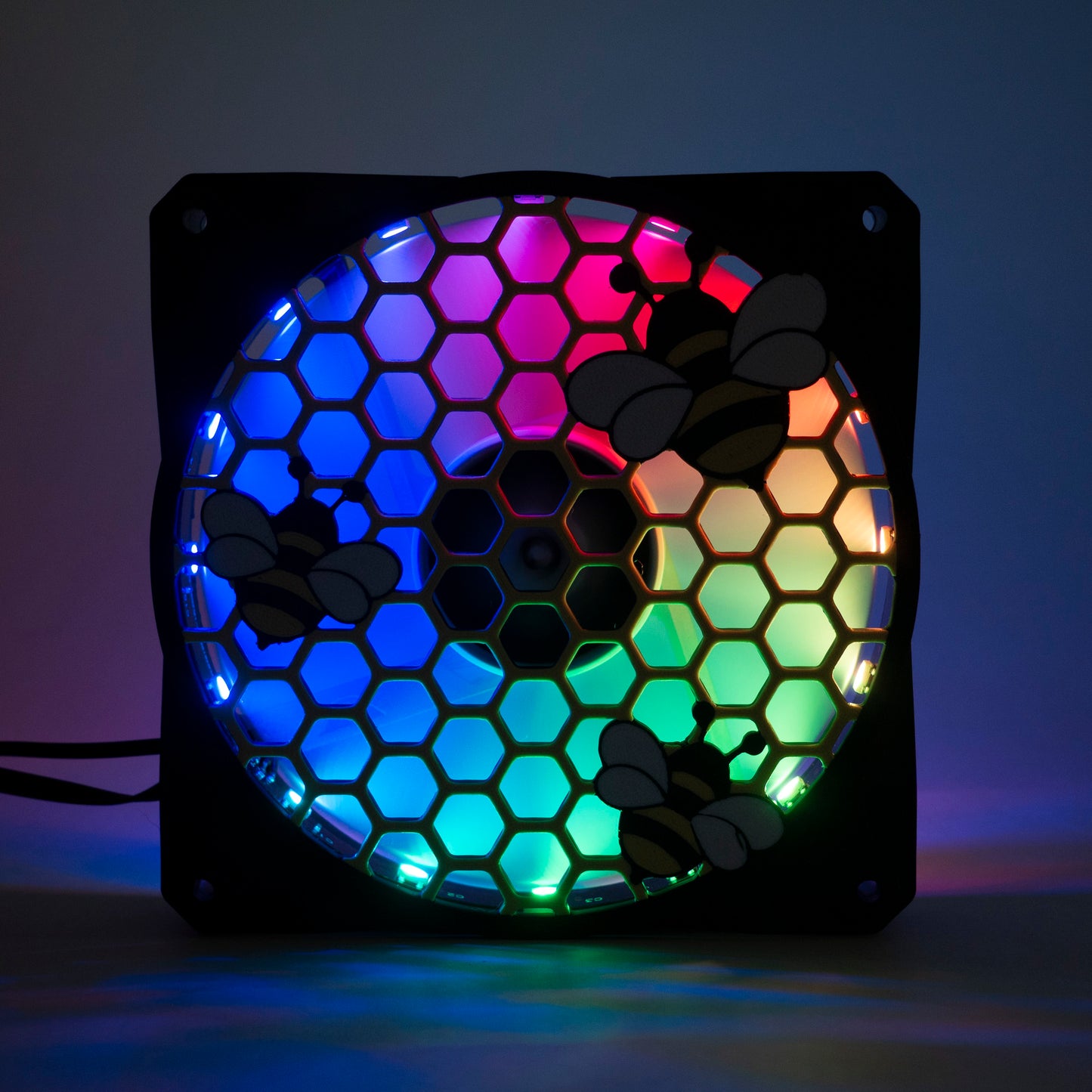 Adorable 3D printed PC fan grill featuring bees and honeycomb. Perfect for customizing aesthetic gamer setups with a cute, nature-inspired design.
