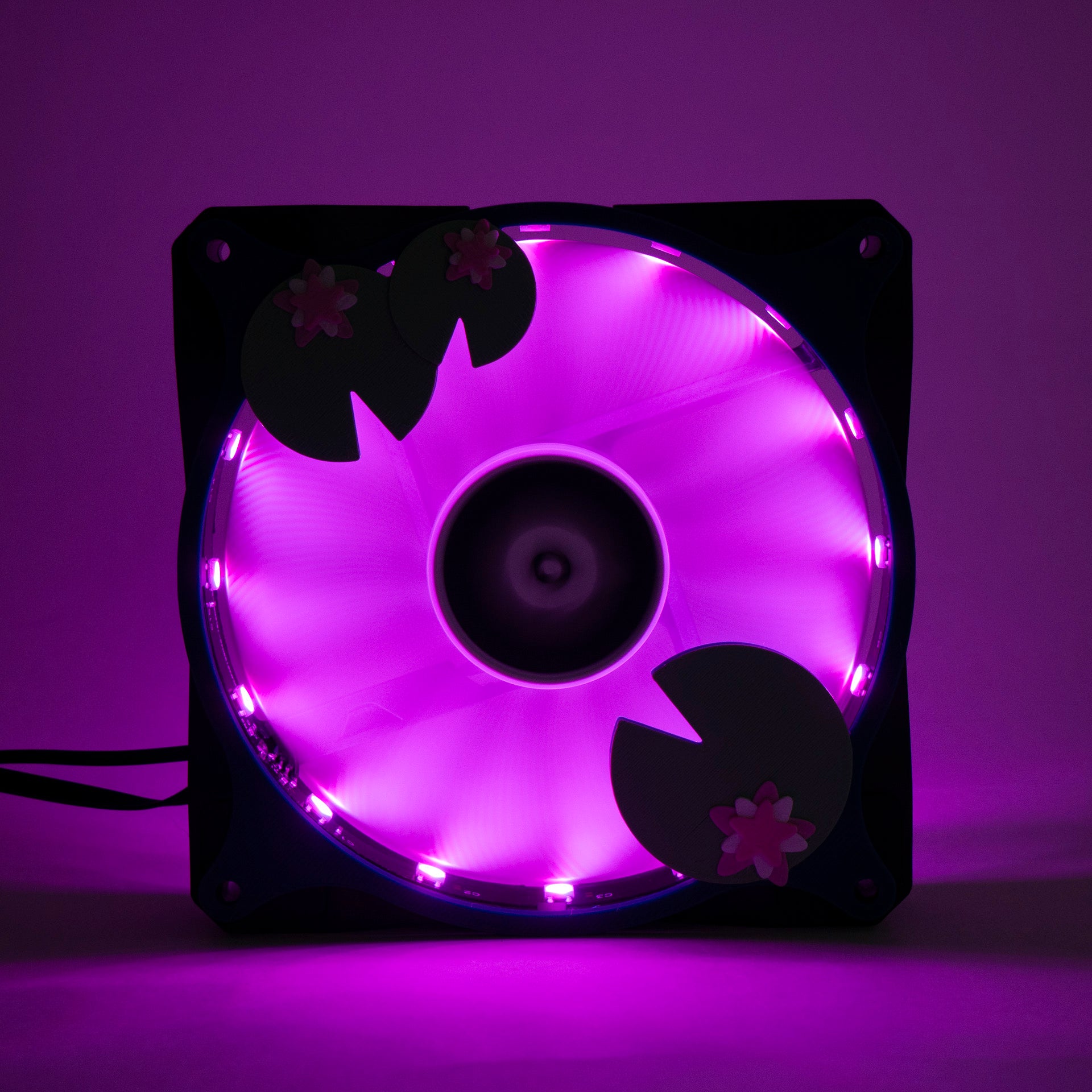Adorable 3D printed PC fan grill with lily pad and lotus flower design. A cute nature-inspired fan cover perfect for cozy, aesthetic gaming setups.