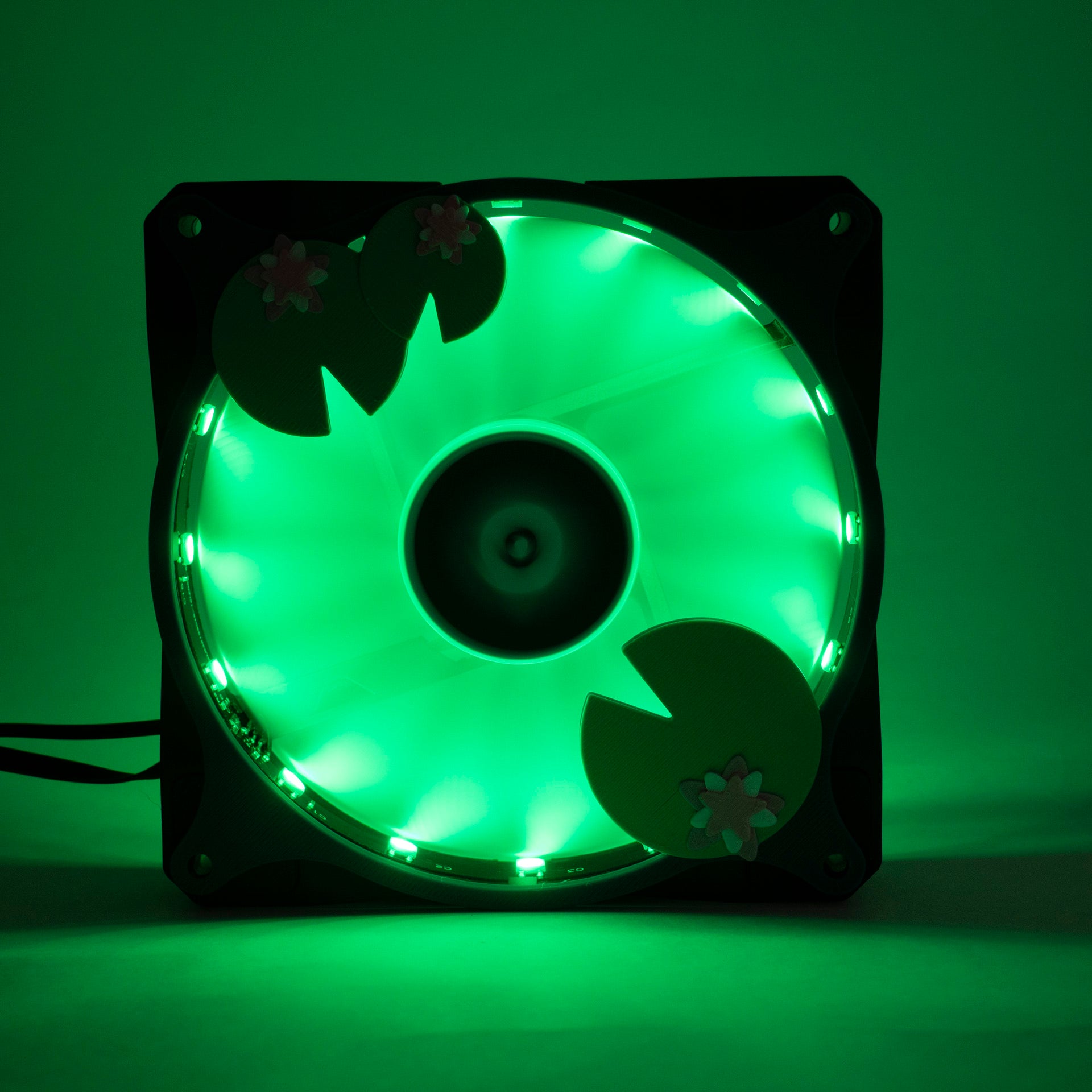 Adorable 3D printed PC fan grill with lily pad and lotus flower design. A cute nature-inspired fan cover perfect for cozy, aesthetic gaming setups.