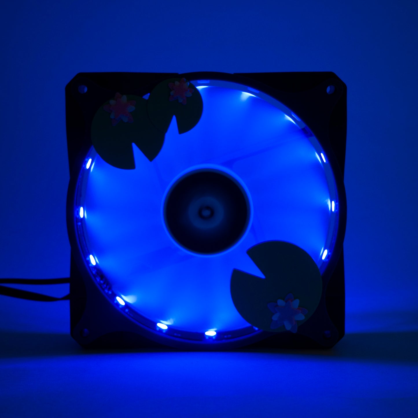 Adorable 3D printed PC fan grill with lily pad and lotus flower design. A cute nature-inspired fan cover perfect for cozy, aesthetic gaming setups.