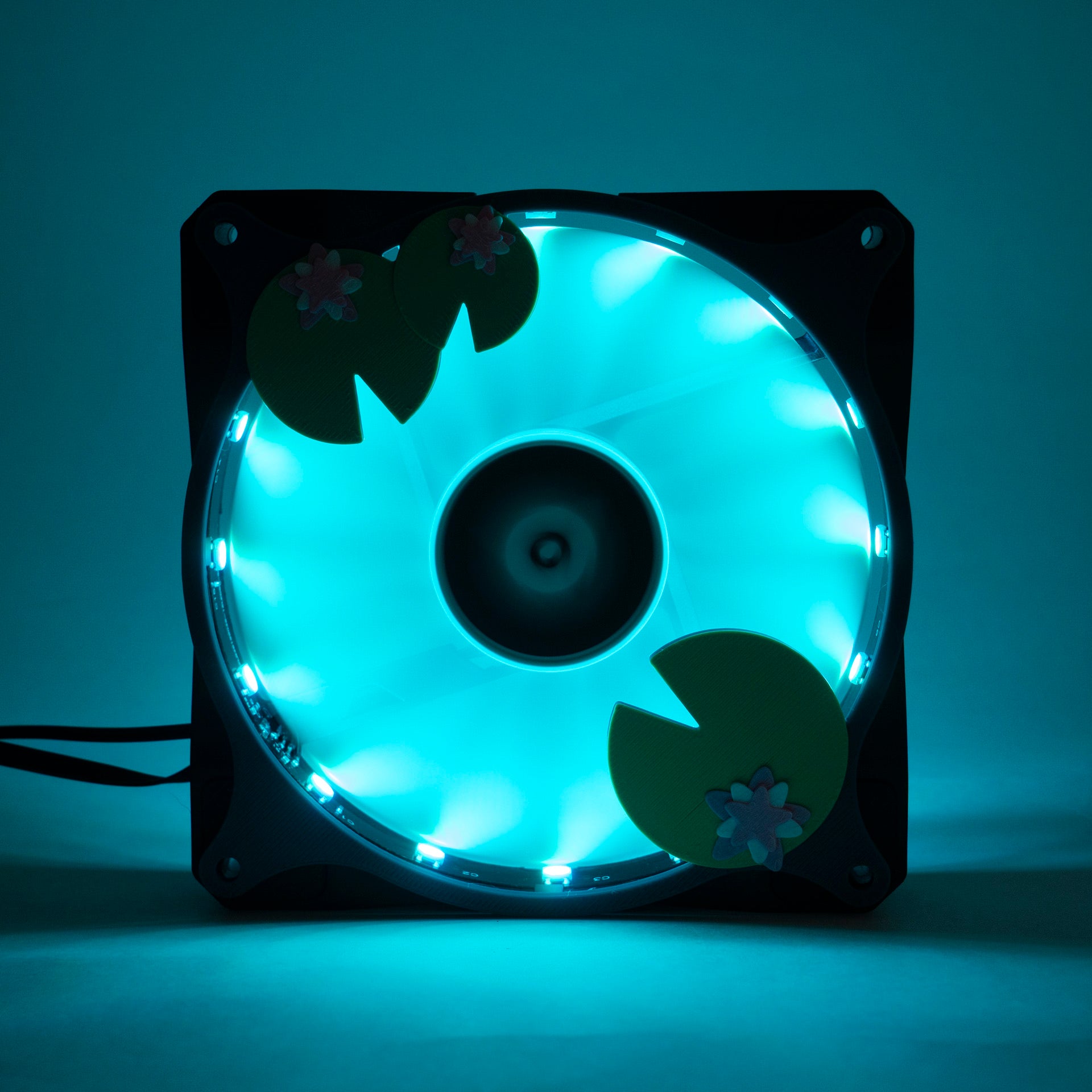 Adorable 3D printed PC fan grill with lily pad and lotus flower design. A cute nature-inspired fan cover perfect for cozy, aesthetic gaming setups.