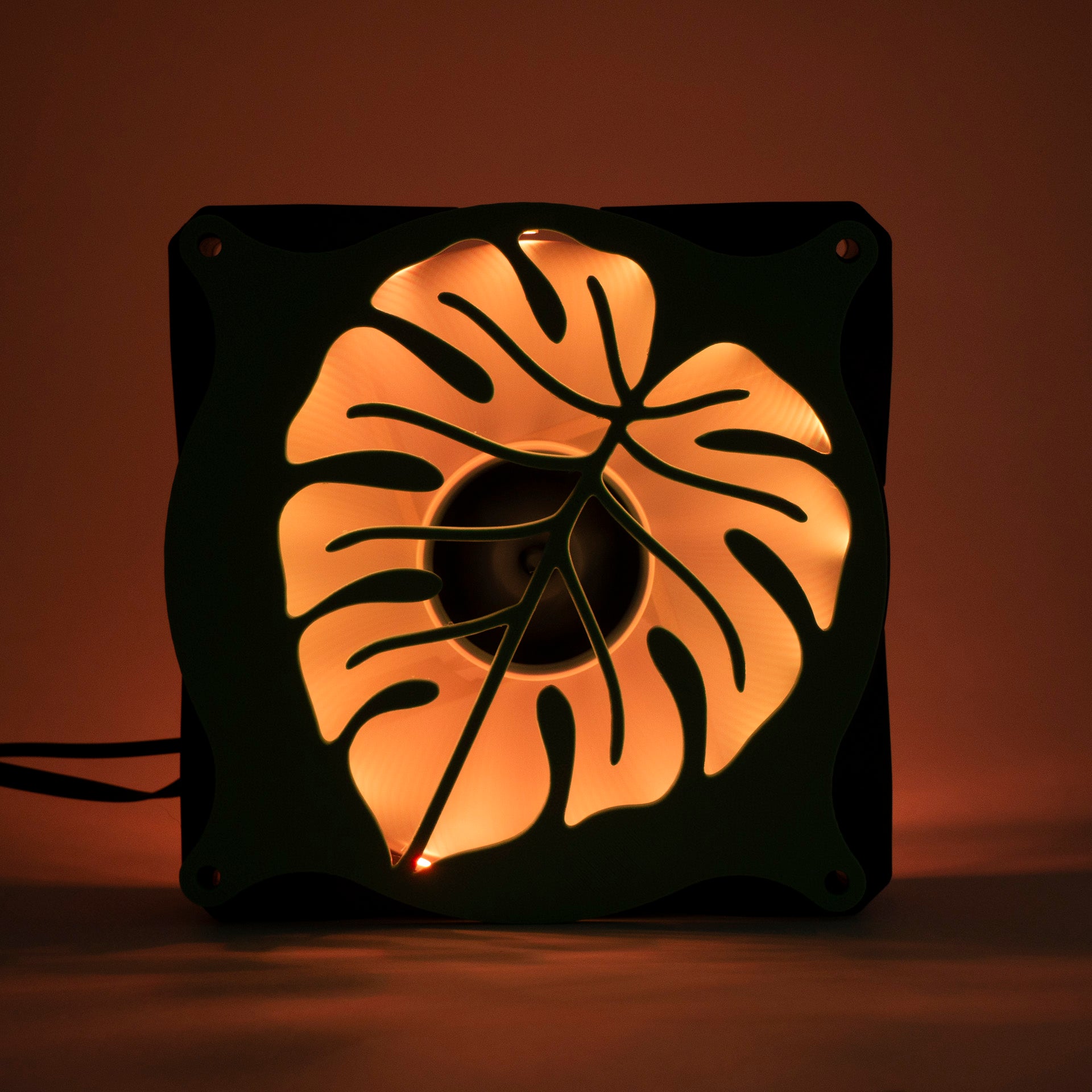 A 3D printed monstera leaf PC fan grill for plant lovers and cozy gamer setups. Adds botanical flair to any gaming tower or aesthetic workspace.