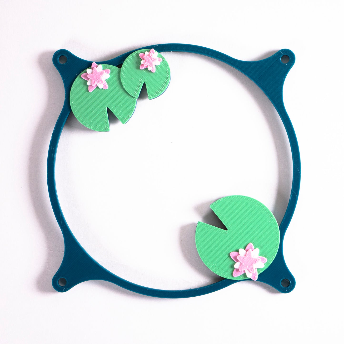 Adorable 3D printed PC fan grill with lily pad and lotus flower design. A cute nature-inspired fan cover perfect for cozy, aesthetic gaming setups.