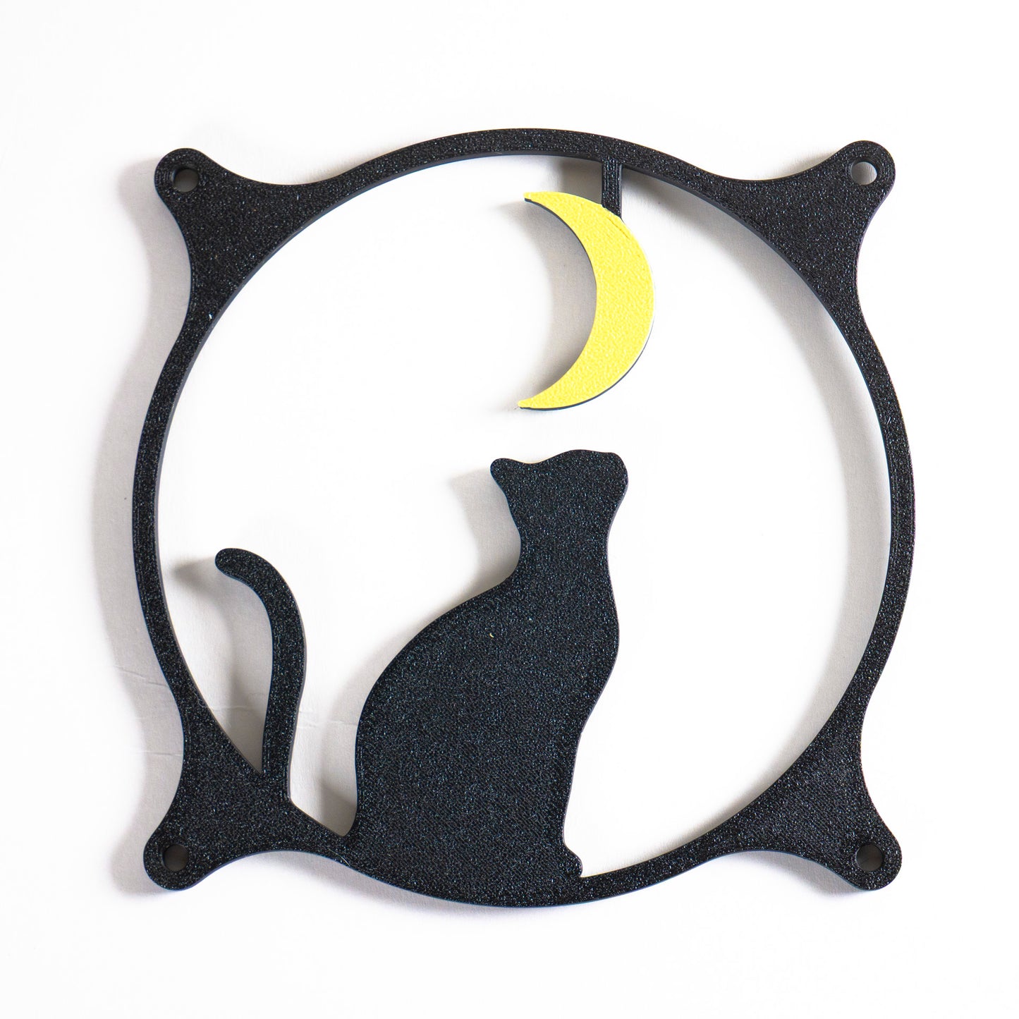 3D printed PC fan grill with a silhouette of a cat gazing at the moon. Perfect for whimsical gaming setups and cat lovers who love custom tech.
