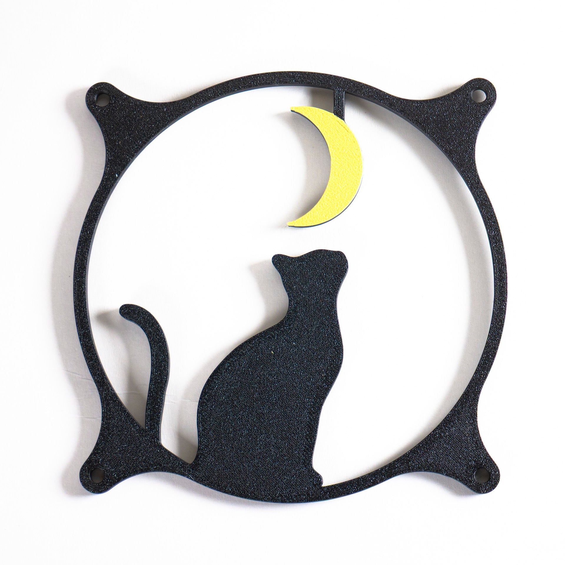3D printed PC fan grill with a silhouette of a cat gazing at the moon. Perfect for whimsical gaming setups and cat lovers who love custom tech.