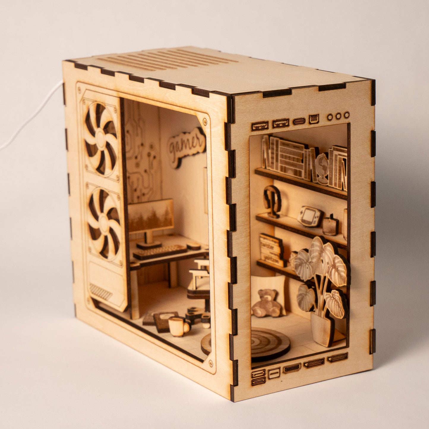 DIY gaming PC book nook kit made from laser-engraved basswood with LED light and remote. A perfect gamer gift and bookshelf insert for tech lovers.