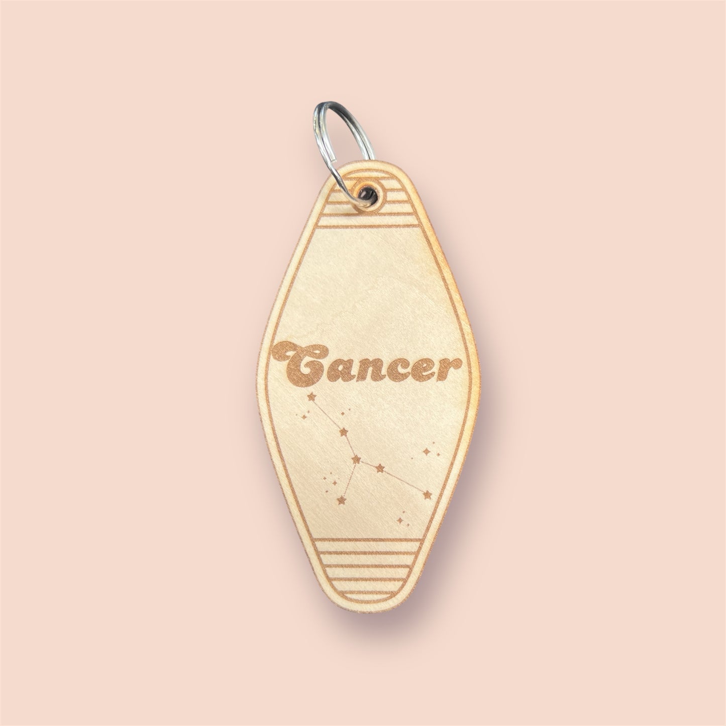 Laser engraved wood motel keychain featuring zodiac names and constellations, perfect for astrology lovers, horoscope fans, and retro gift collectors. This is for the Zodiac sign Cancer.