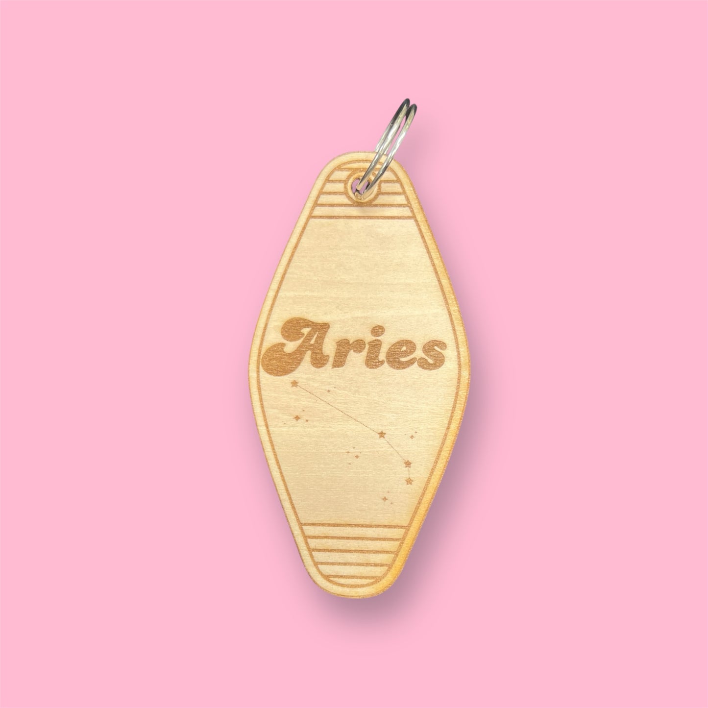 Laser engraved wood motel keychain featuring zodiac names and constellations, perfect for astrology lovers, horoscope fans, and retro gift collectors. This is for the Zodiac sign Aries.