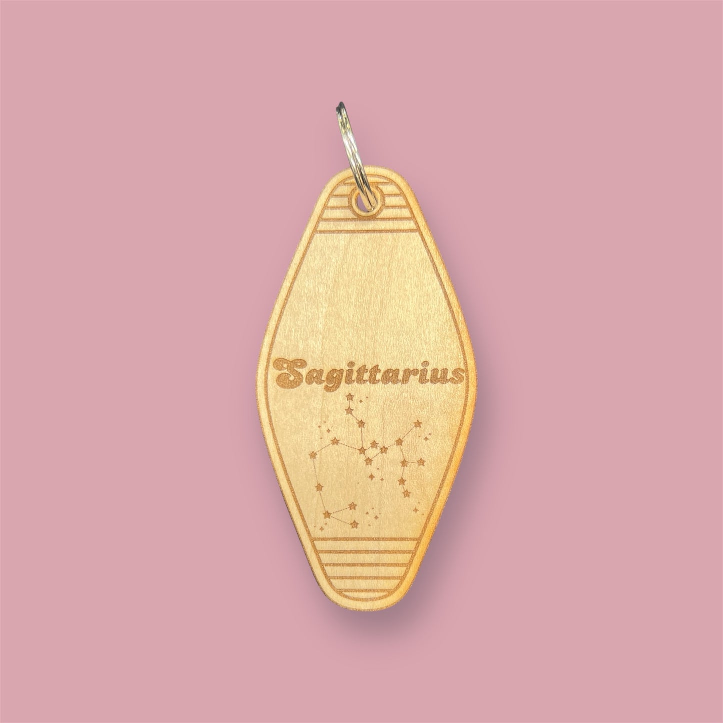 Laser engraved wood motel keychain featuring zodiac names and constellations, perfect for astrology lovers, horoscope fans, and retro gift collectors. This is for the Zodiac sign Sagittarius.