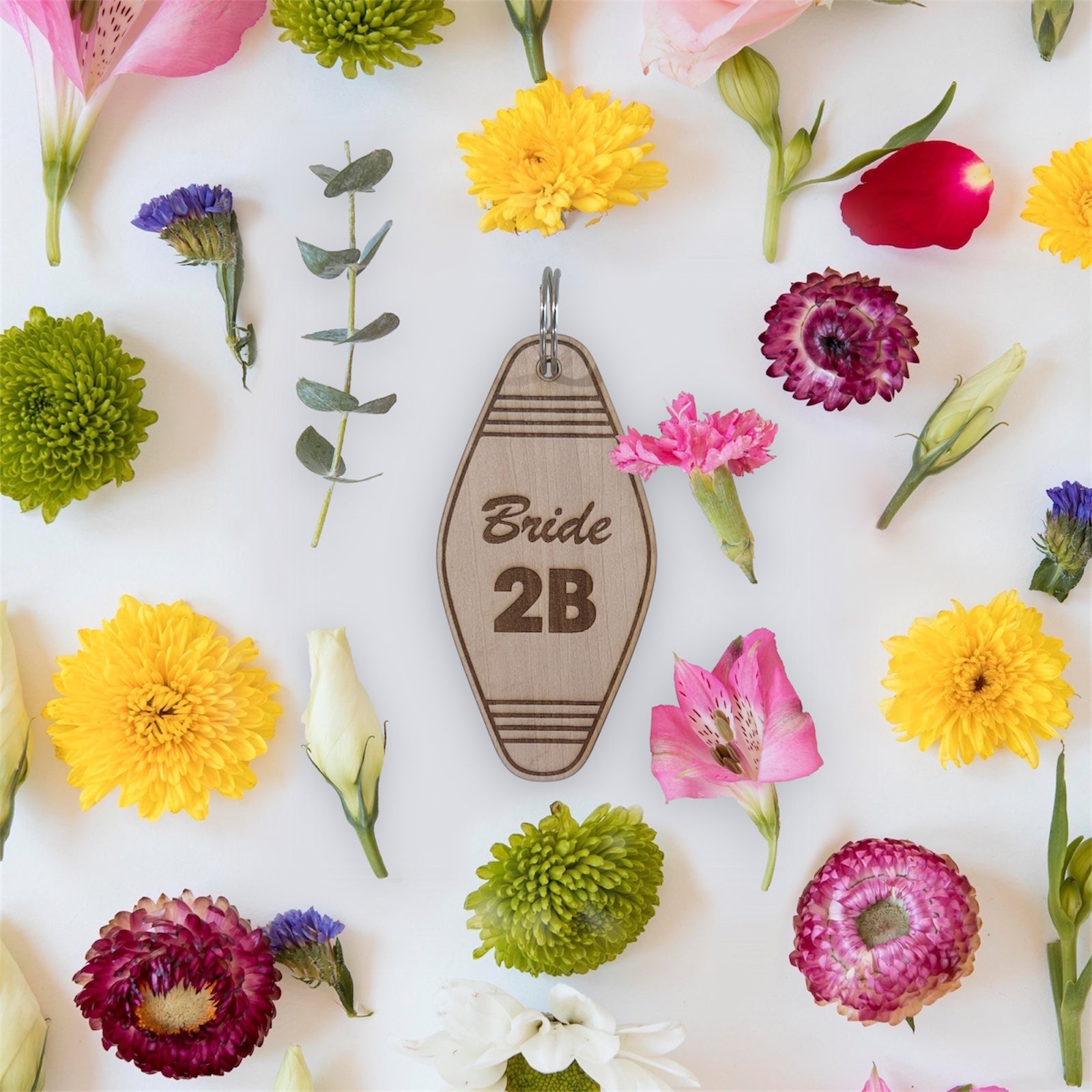 Laser engraved wooden motel keychain with “Bride 2B” design. A cute and retro gift for bridal showers, weddings, or bachelorette parties.