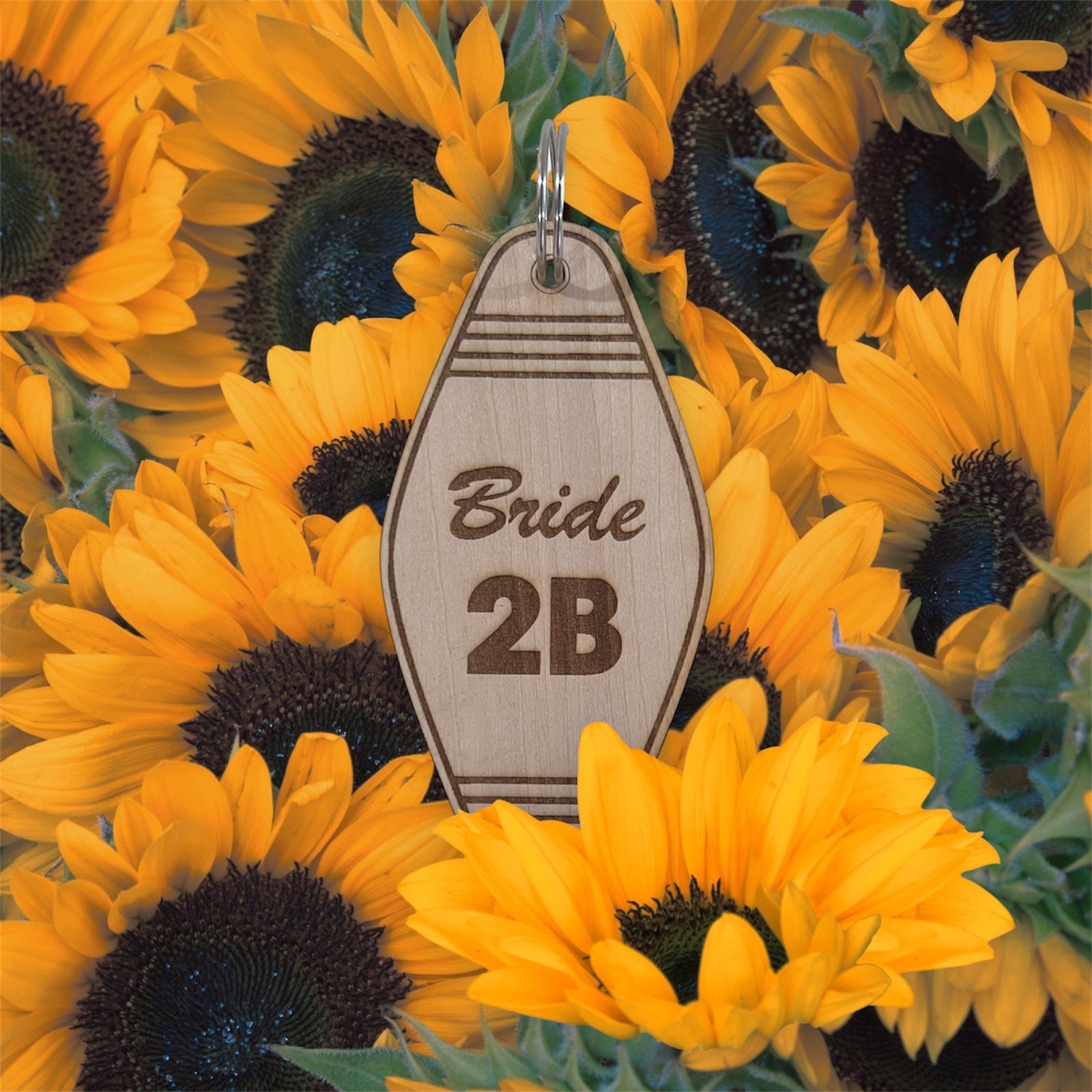 Wooden tag with 'Bride 2B' text on sunflower background