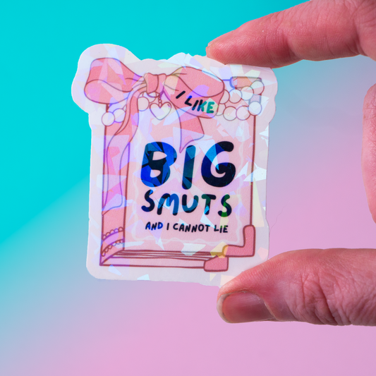 Holographic vinyl sticker featuring a pink book with pearls and the phrase I Like Big Smuts and I Cannot Lie. Perfect for romance book lovers, spicy book readers, and bookish aesthetic fans.