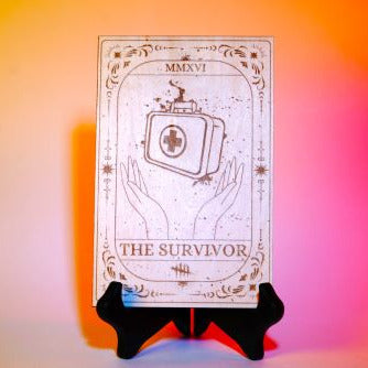 Laser-engraved wooden tarot card inspired by Dead by Daylight, featuring "The Survivor" medkit design. Horror game decor, perfect for DBD fans and collectors.