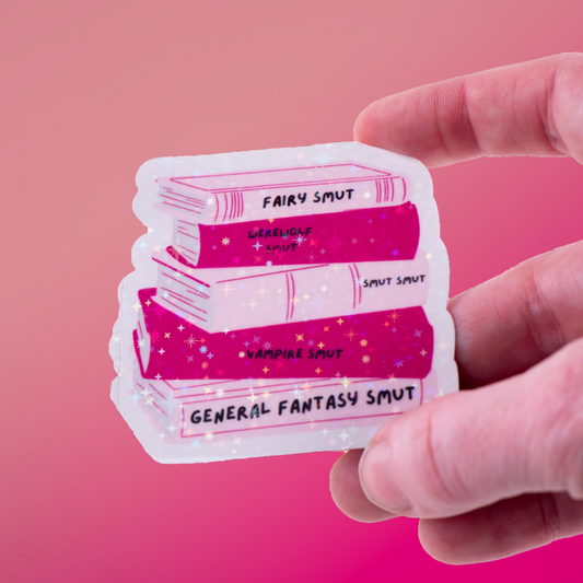 Holographic sticker featuring a pink book stack labeled Fairy Smut, Werewolf Smut, Vampire Smut, and more. A must-have for fantasy romance and spicy book lovers!