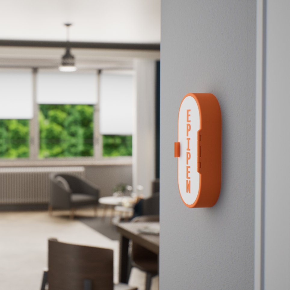 Wall-mounted, blue and white EpiPen storage case designed for easy access in emergencies. Durable, sleek, and perfect for mounting on walls in homes, offices, or schools for safe storage of epinephrine injectors.