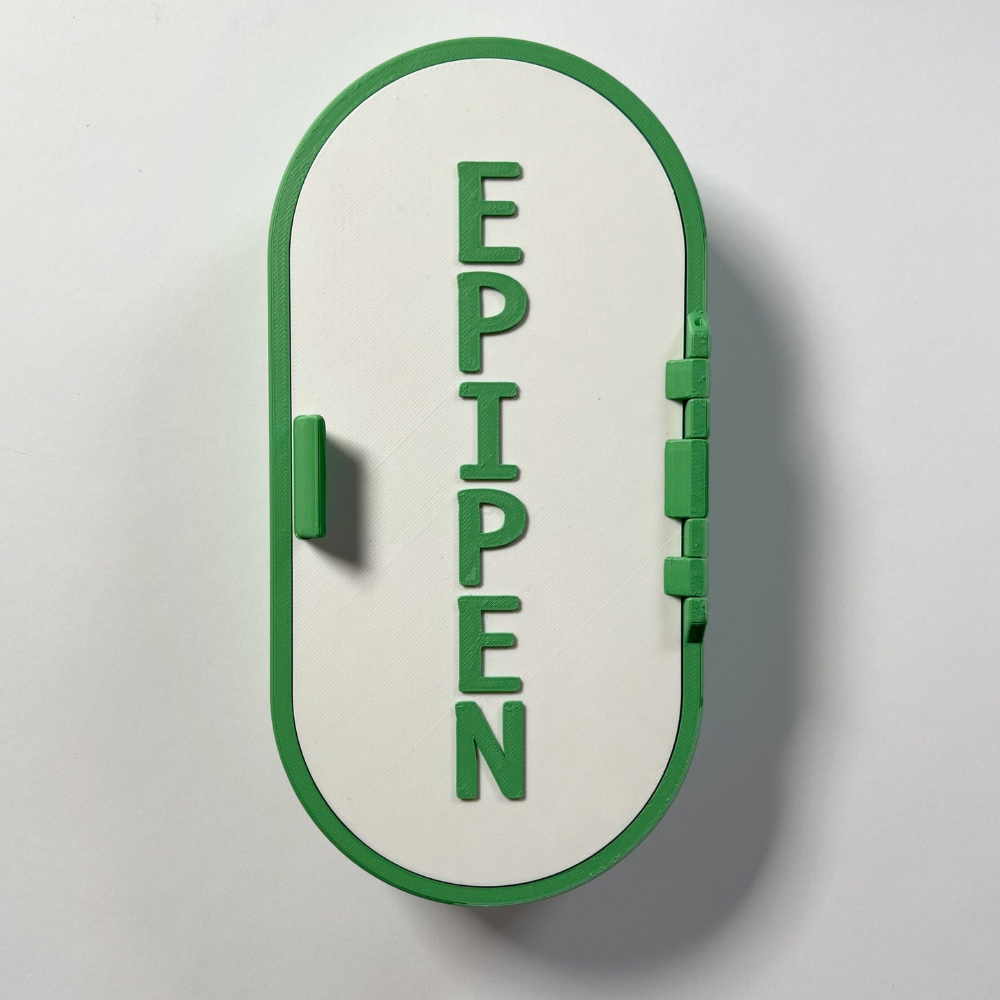 Wall-mounted, blue and white EpiPen storage case designed for easy access in emergencies. Durable, sleek, and perfect for mounting on walls in homes, offices, or schools for safe storage of epinephrine injectors.