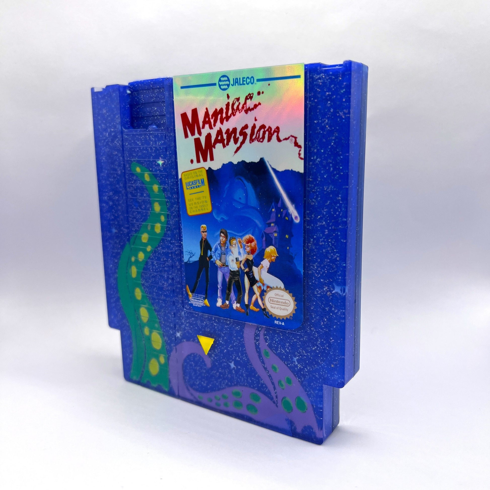 Handmade custom Maniac Mansion NES cartridge art, featuring a starry night background and iconic tentacles from the game. Perfect for displaying as unique gamer decor or a gift for retro game enthusiasts.