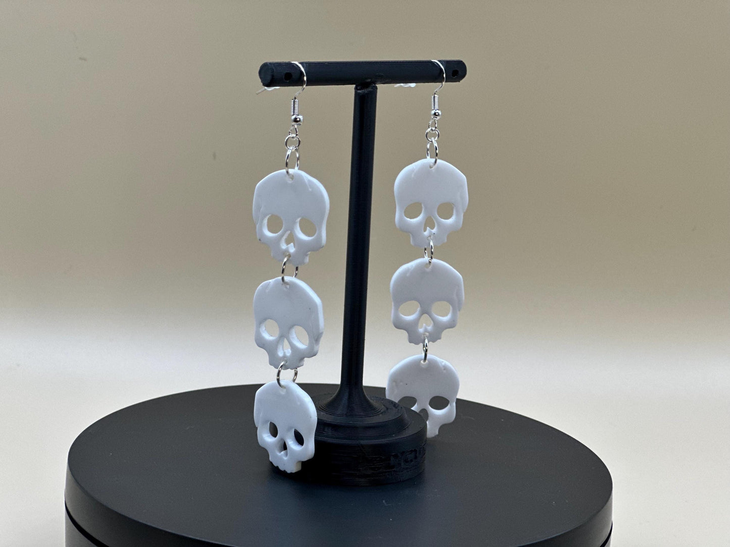 Stacked Skulls Dangle Earrings: Steel & Resin