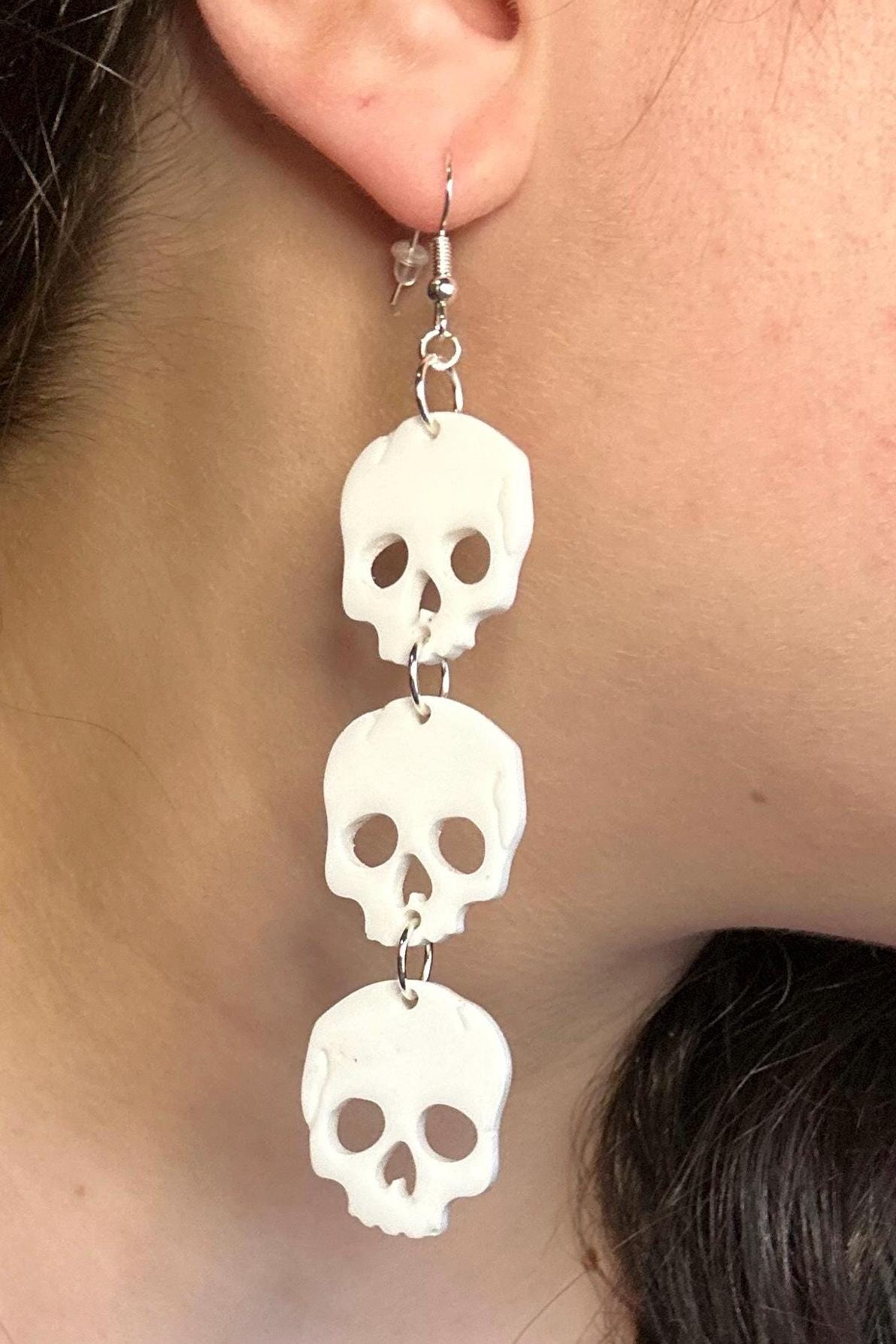 Stacked Skulls Dangle Earrings: Steel & Resin