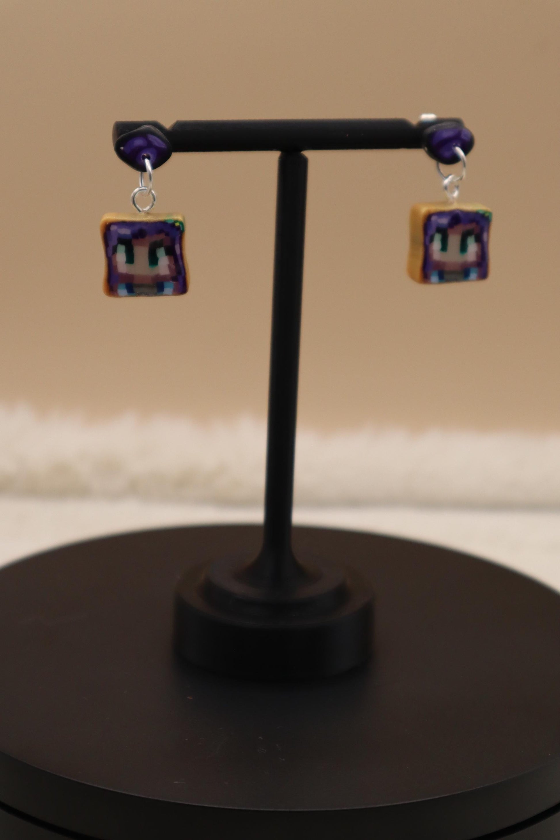 Handmade dangle earrings inspired by Abigail’s love of amethysts in Stardew Valley. Perfect gamer girl gift, cosplay jewelry, or crystal fan accessory.