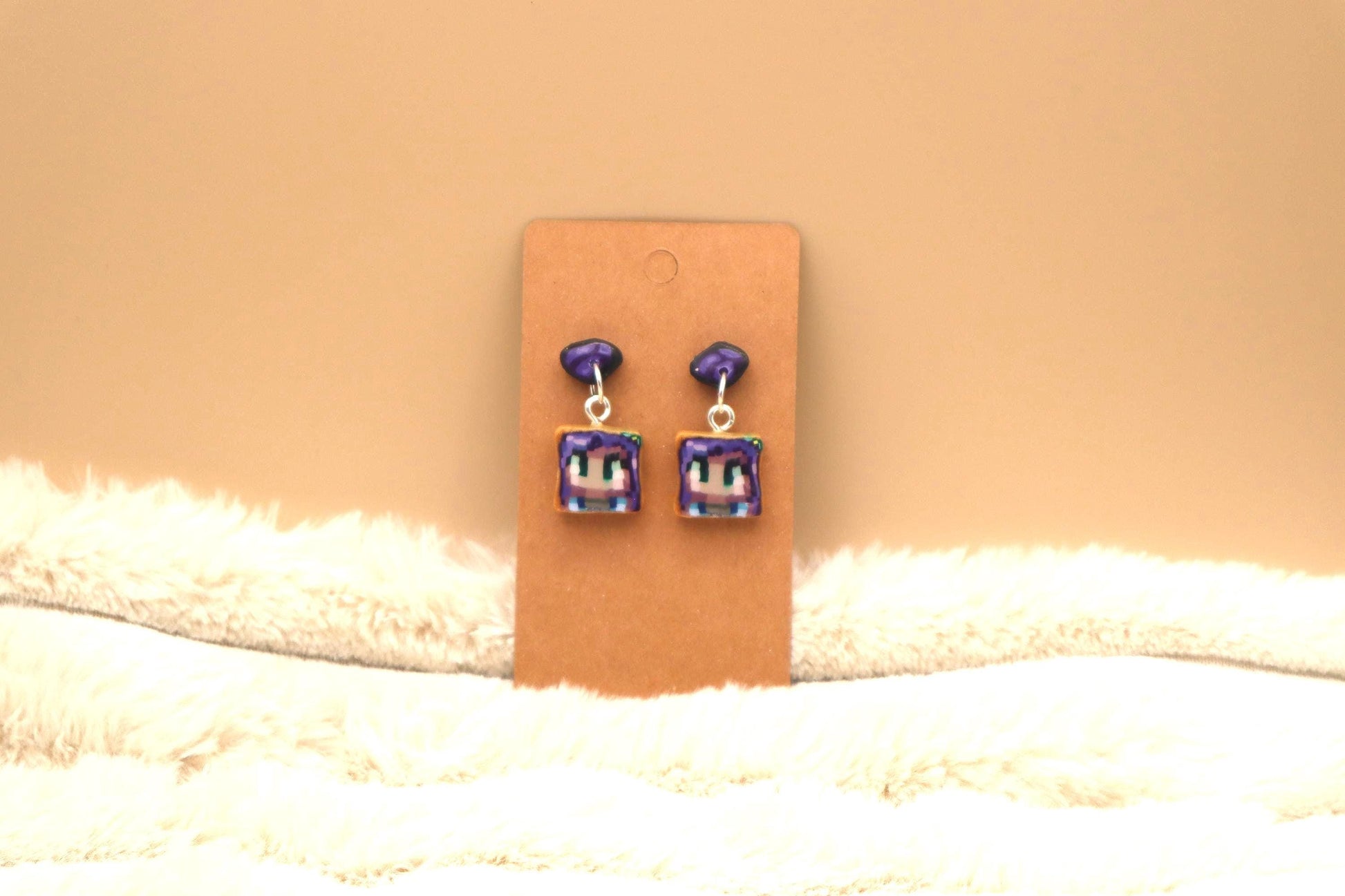 Handmade dangle earrings inspired by Abigail’s love of amethysts in Stardew Valley. Perfect gamer girl gift, cosplay jewelry, or crystal fan accessory.