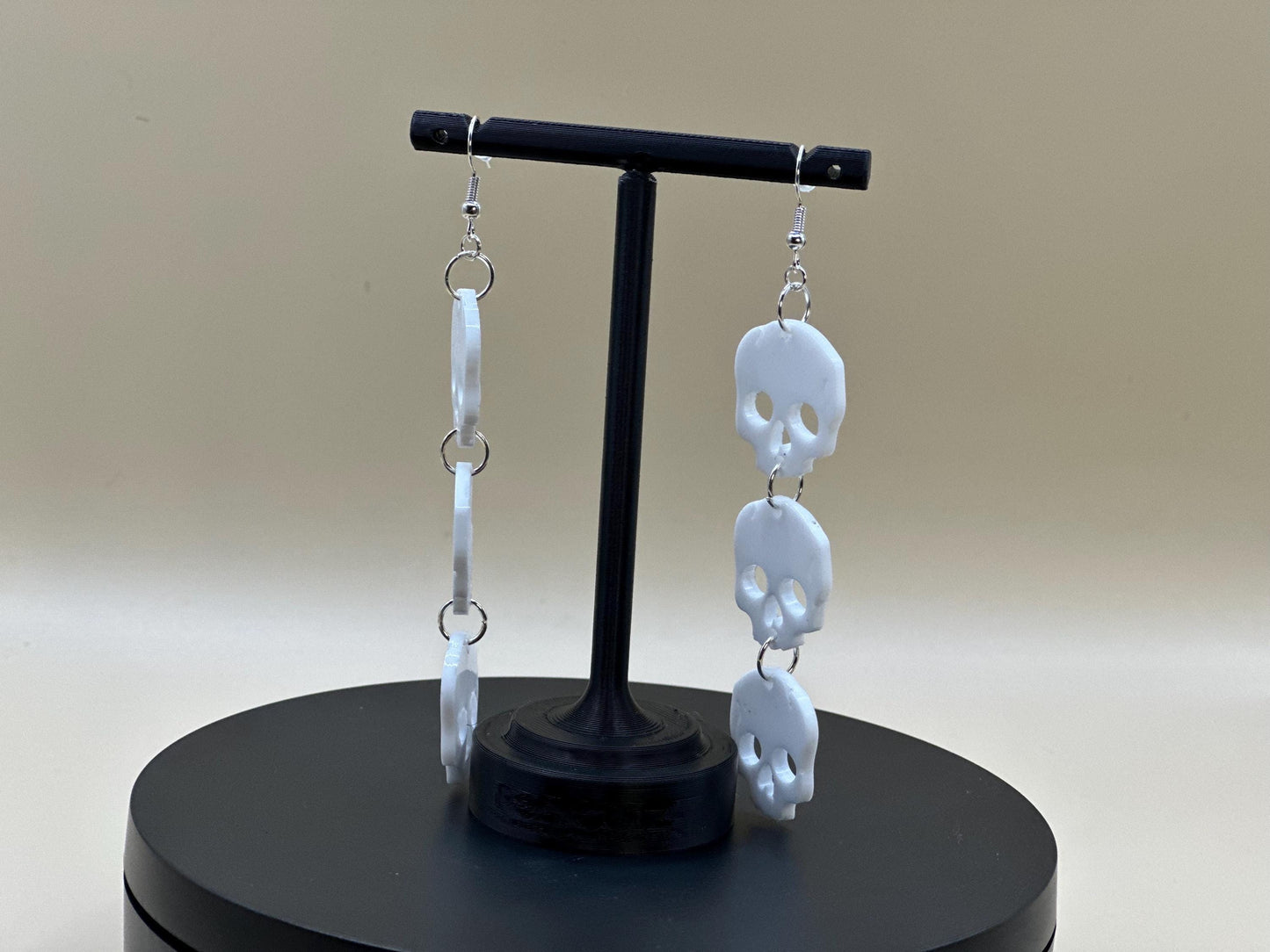 Stacked Skulls Dangle Earrings: Steel & Resin