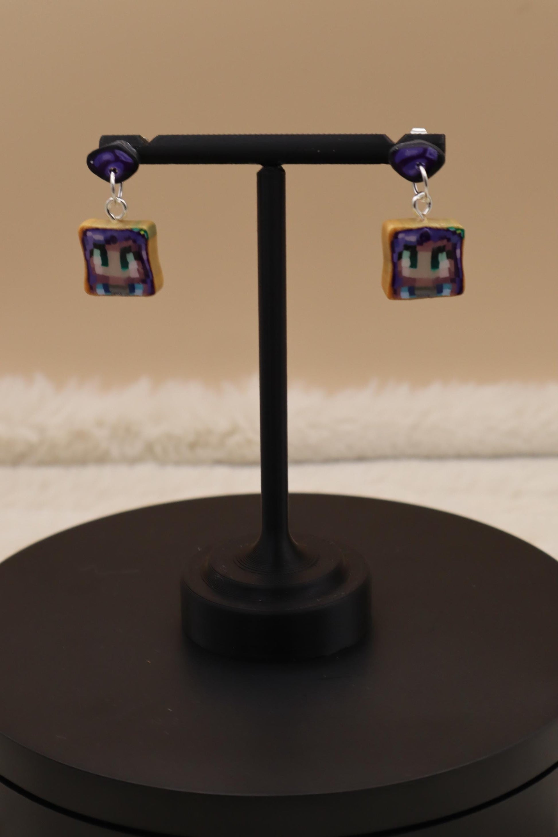 Handmade dangle earrings inspired by Abigail’s love of amethysts in Stardew Valley. Perfect gamer girl gift, cosplay jewelry, or crystal fan accessory.