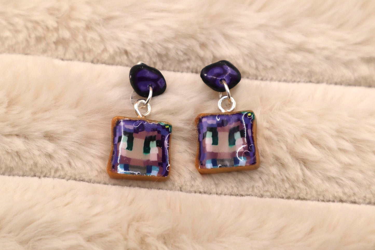 Handmade dangle earrings inspired by Abigail’s love of amethysts in Stardew Valley. Perfect gamer girl gift, cosplay jewelry, or crystal fan accessory.