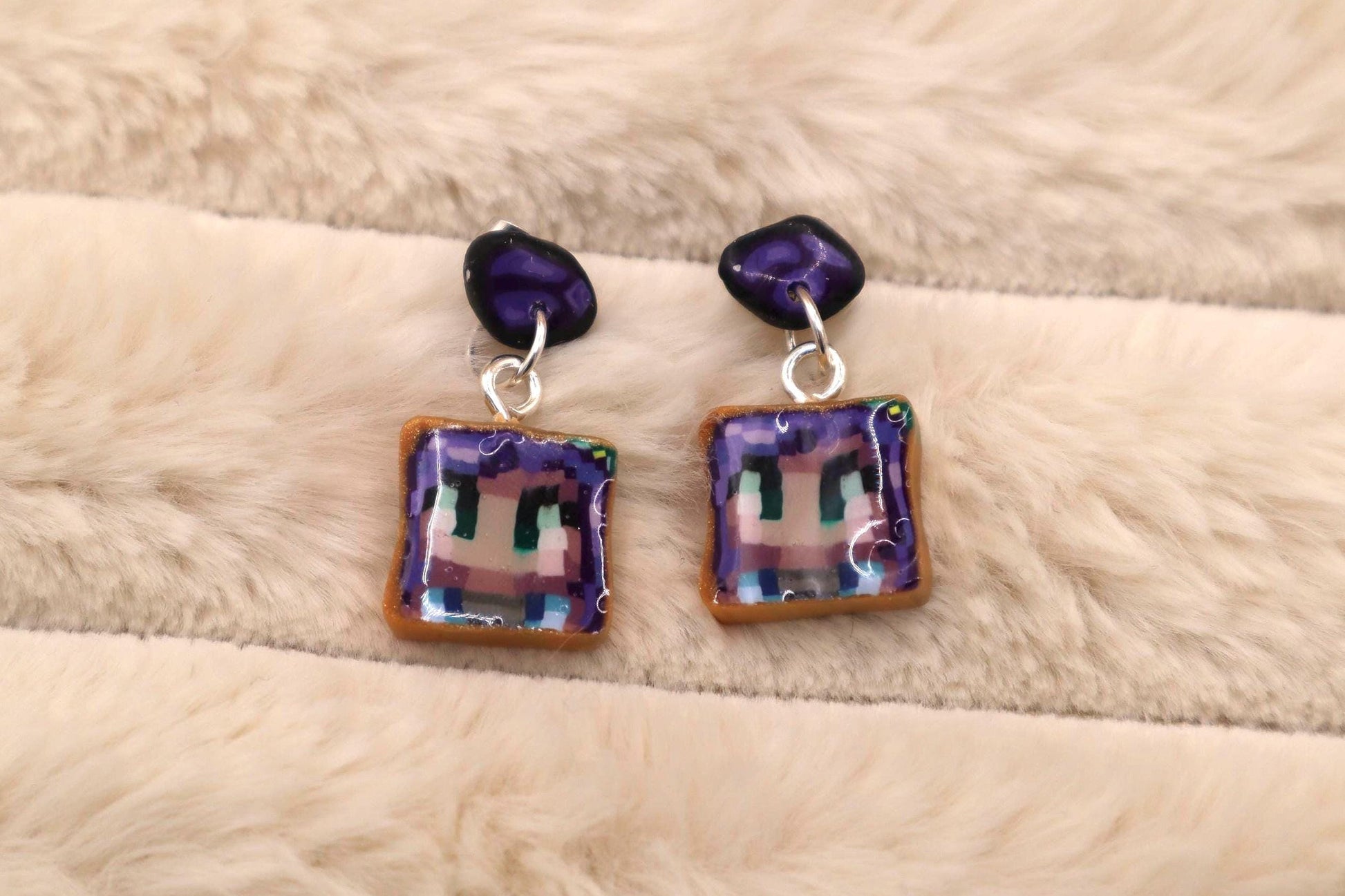 Handmade dangle earrings inspired by Abigail’s love of amethysts in Stardew Valley. Perfect gamer girl gift, cosplay jewelry, or crystal fan accessory.