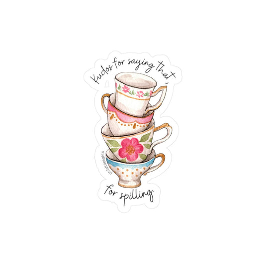 Whimsical vinyl sticker featuring a stack of colorful tea cups with the phrase Kudos for saying that. Perfect for tea lovers and those who enjoy spilling the tea. Great for decorating laptops or journals