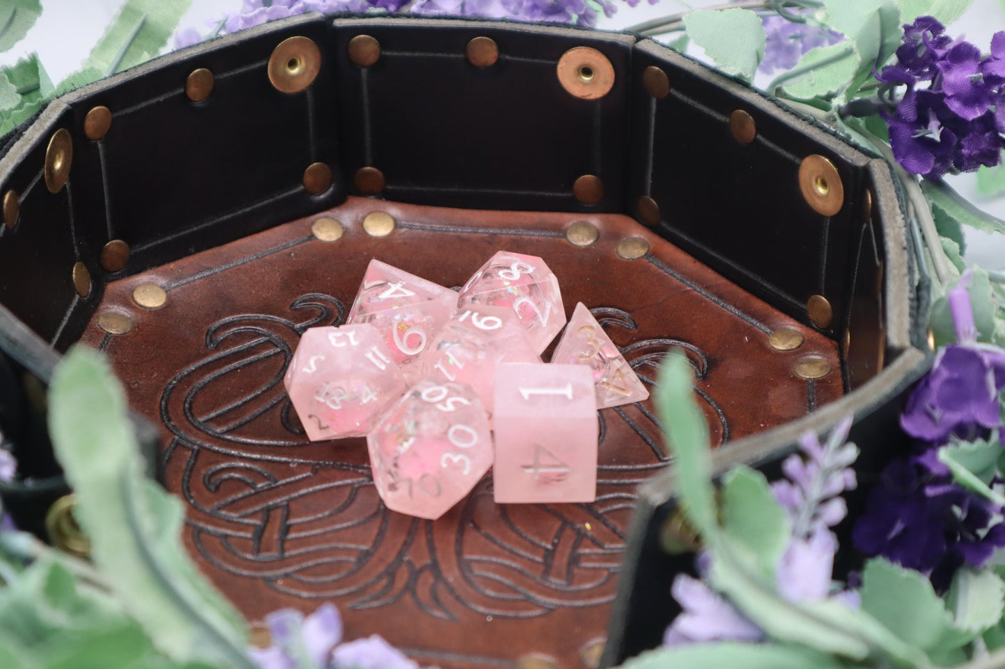 Handmade pink and white glitter liquid core resin dice set with shimmer effect, perfect for DnD, TTRPG players, and fantasy-themed gaming sessions.