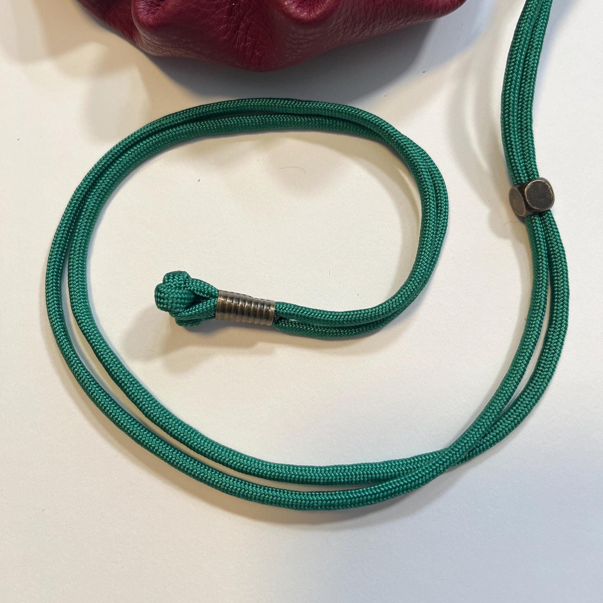 Handcrafted leather dice bag with drawstring, ideal for storing RPG dice sets. Perfect for DnD, tabletop games, or as a fantasy gift for gamers.