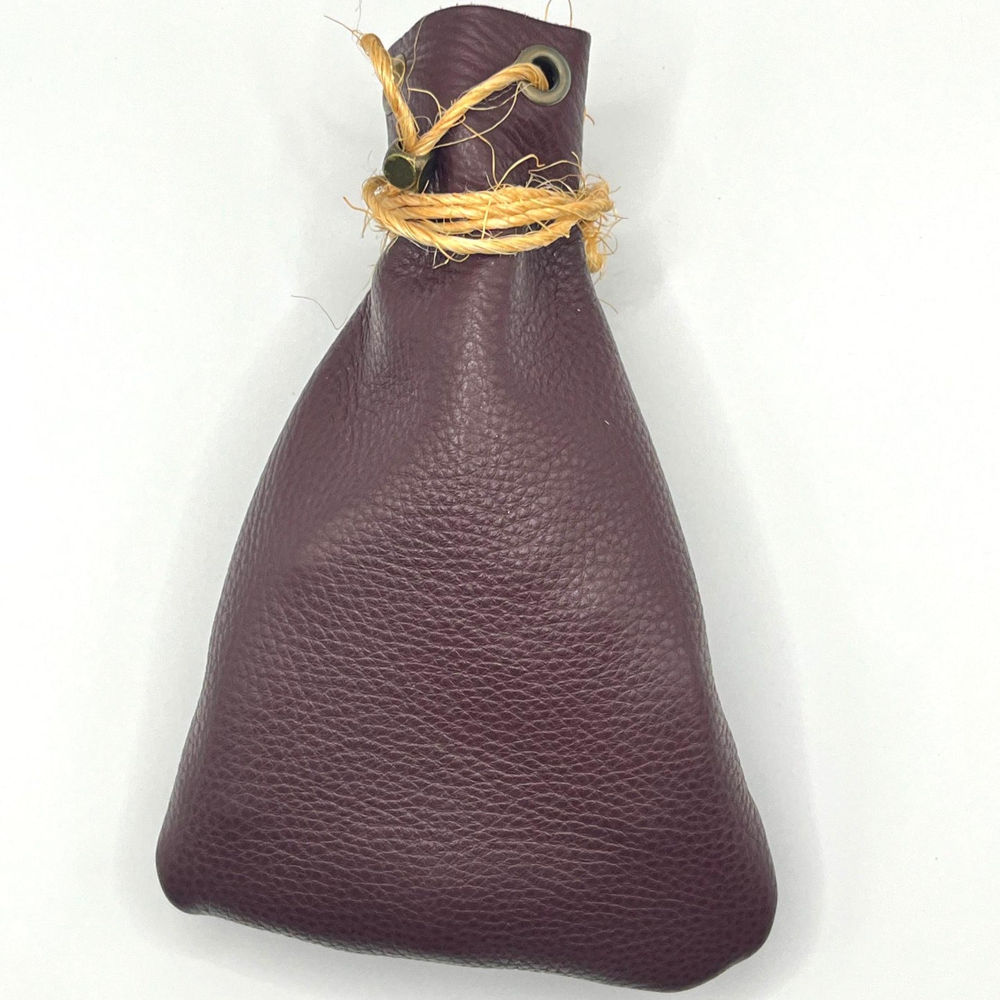 Handcrafted leather dice bag with drawstring, ideal for storing RPG dice sets. Perfect for DnD, tabletop games, or as a fantasy gift for gamers.