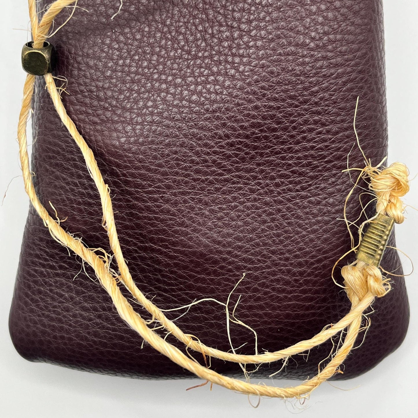 Handcrafted leather dice bag with drawstring, ideal for storing RPG dice sets. Perfect for DnD, tabletop games, or as a fantasy gift for gamers.