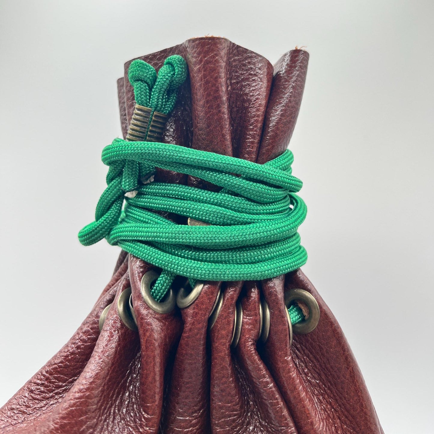 Handcrafted leather dice bag with drawstring, ideal for storing RPG dice sets. Perfect for DnD, tabletop games, or as a fantasy gift for gamers.