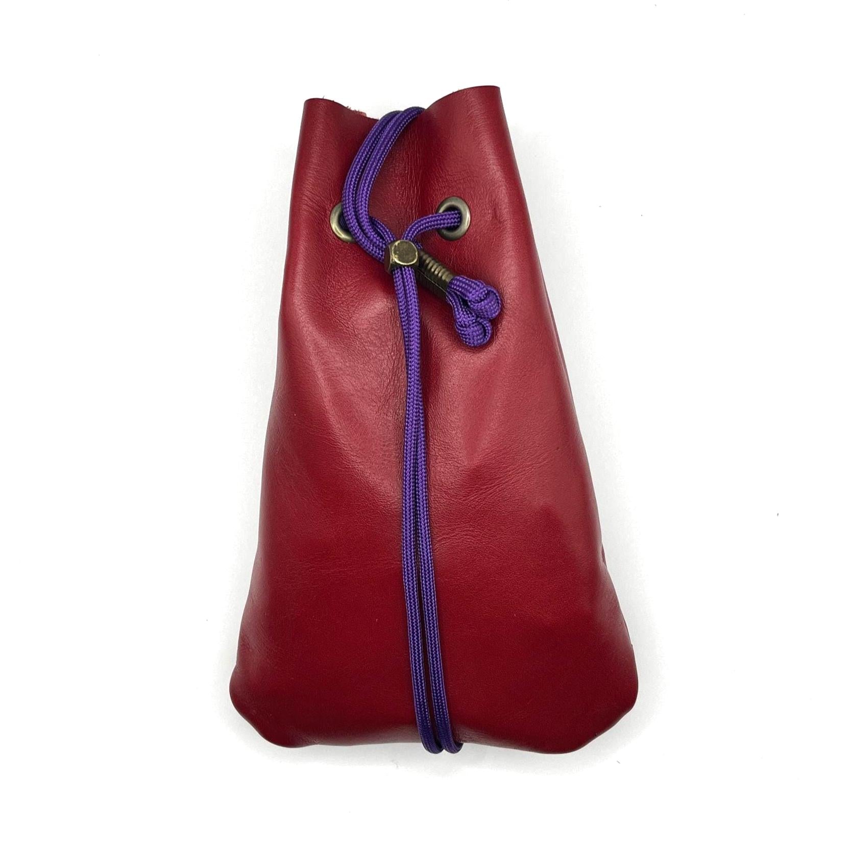 Handcrafted leather dice bag with drawstring, ideal for storing RPG dice sets. Perfect for DnD, tabletop games, or as a fantasy gift for gamers.