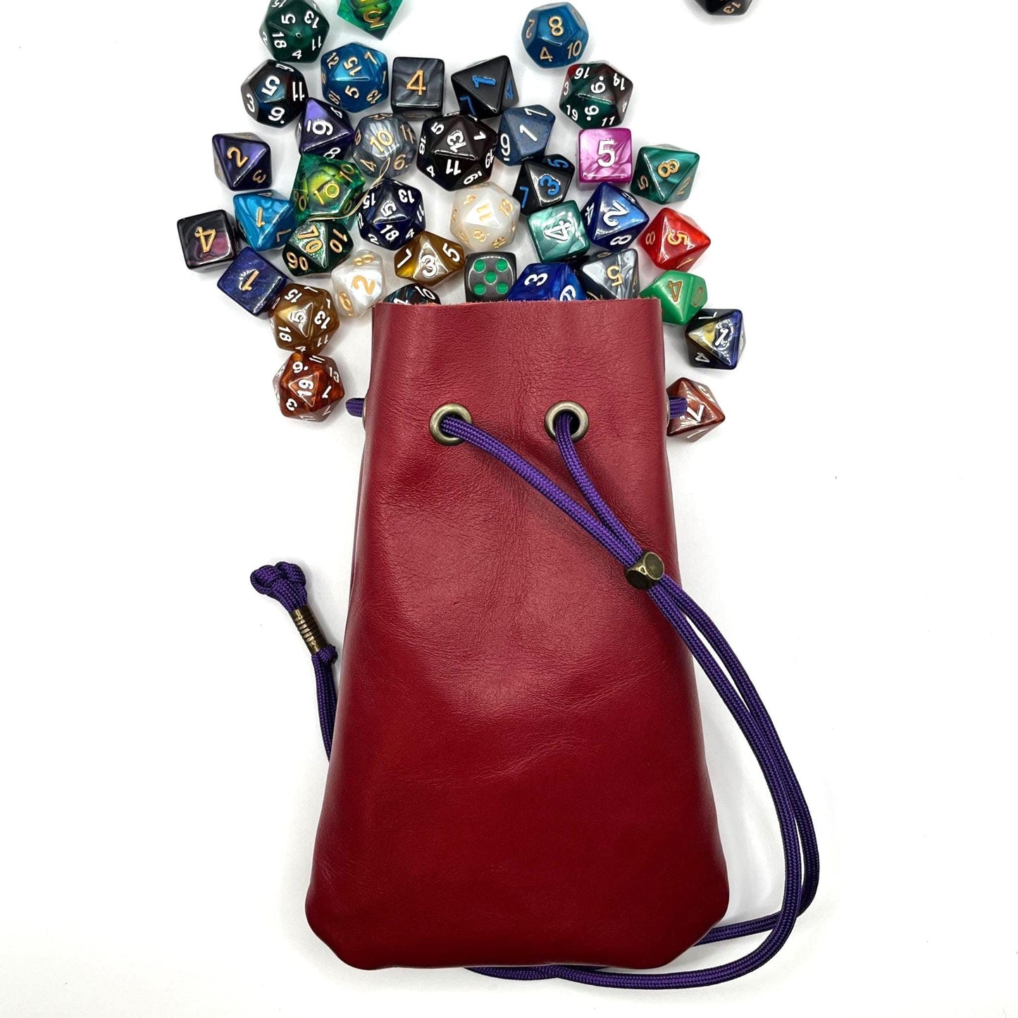 Handcrafted leather dice bag with drawstring, ideal for storing RPG dice sets. Perfect for DnD, tabletop games, or as a fantasy gift for gamers.