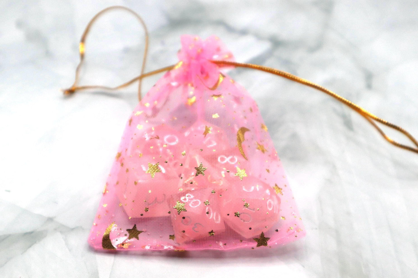 Handmade pink and white glitter liquid core resin dice set with shimmer effect, perfect for DnD, TTRPG players, and fantasy-themed gaming sessions.
