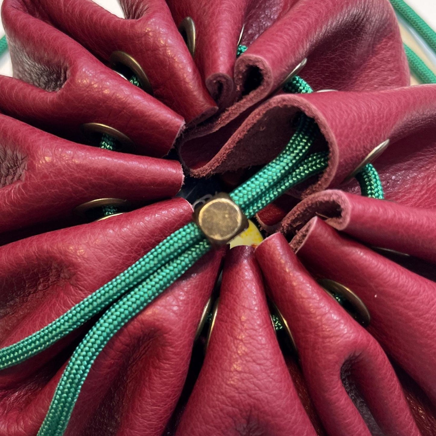 Handcrafted leather dice bag with drawstring, ideal for storing RPG dice sets. Perfect for DnD, tabletop games, or as a fantasy gift for gamers.