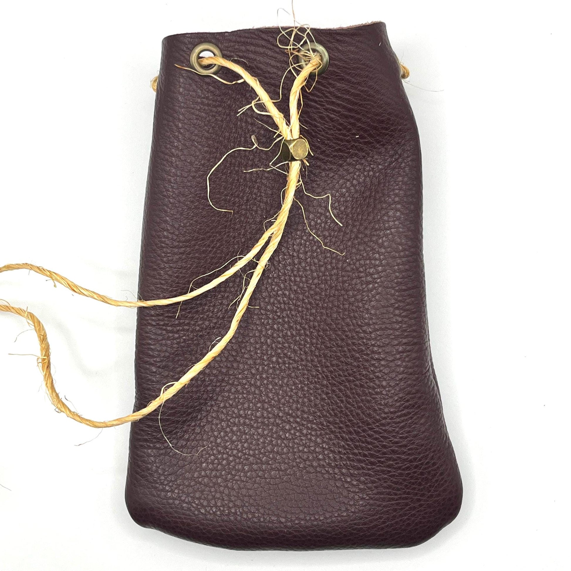 Handcrafted leather dice bag with drawstring, ideal for storing RPG dice sets. Perfect for DnD, tabletop games, or as a fantasy gift for gamers.