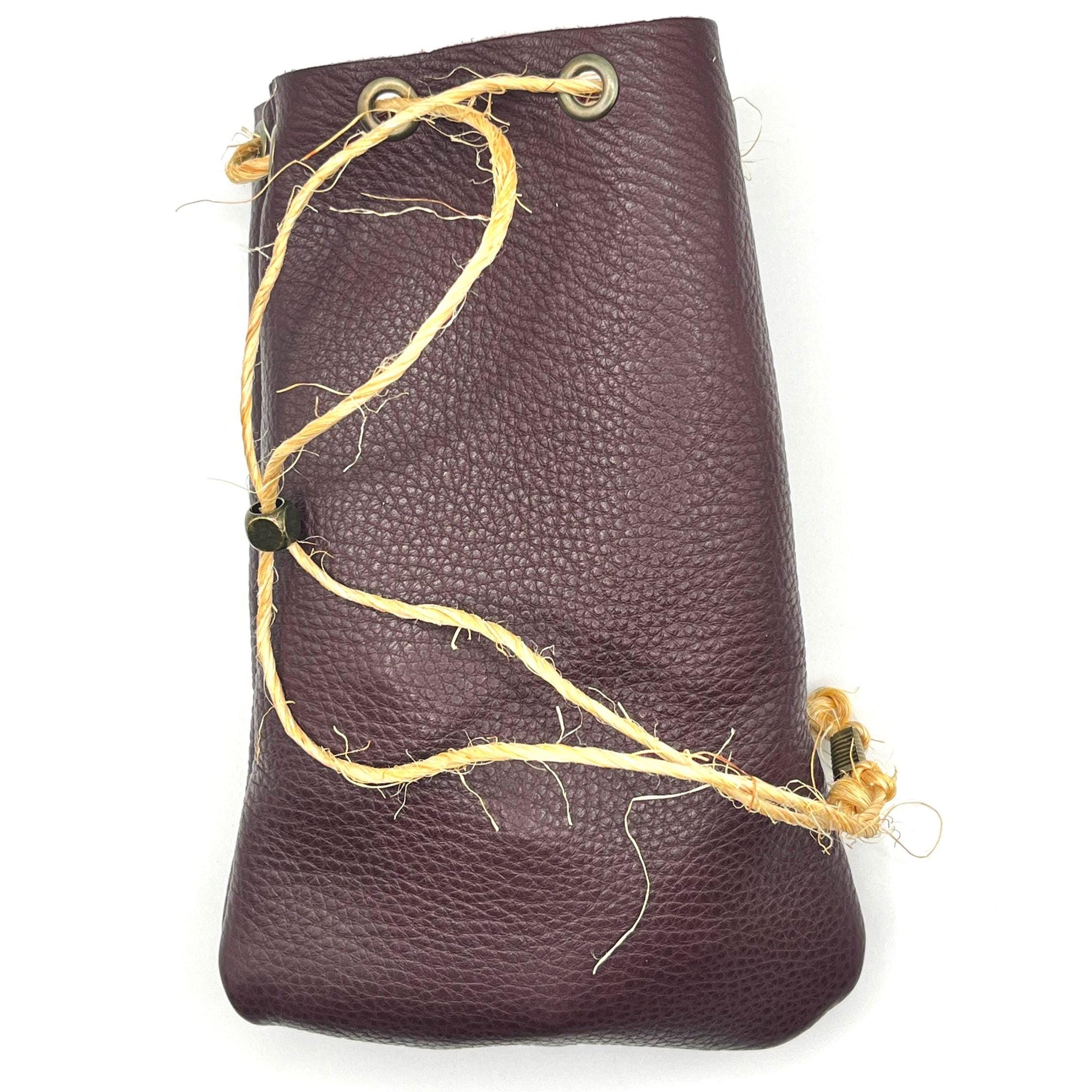 Handcrafted leather dice bag with drawstring, ideal for storing RPG dice sets. Perfect for DnD, tabletop games, or as a fantasy gift for gamers.